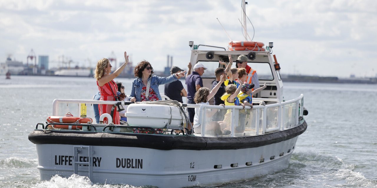 white boat on water with people on it 